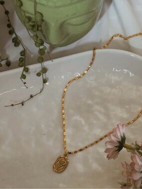 Gold Pendant Necklace with Floral Medallion